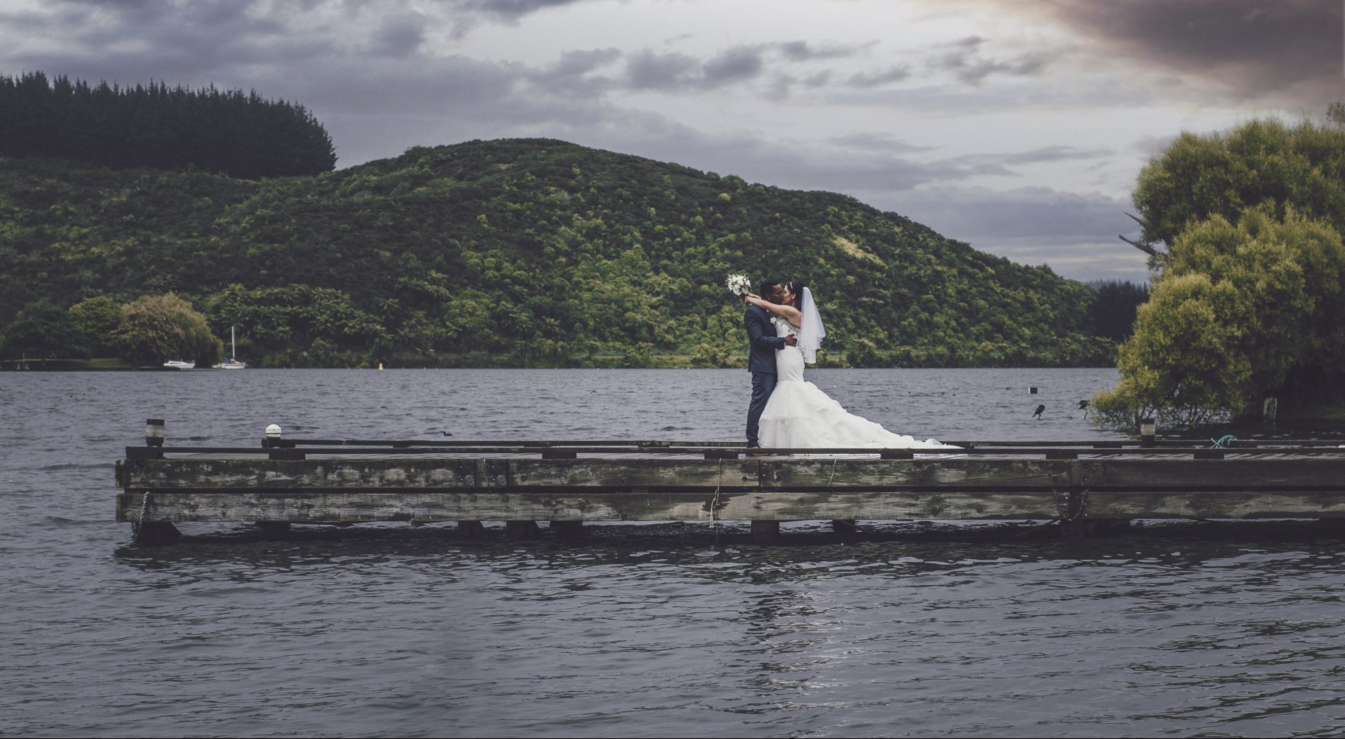 Married couple on the pier at Lake Rotoiti.